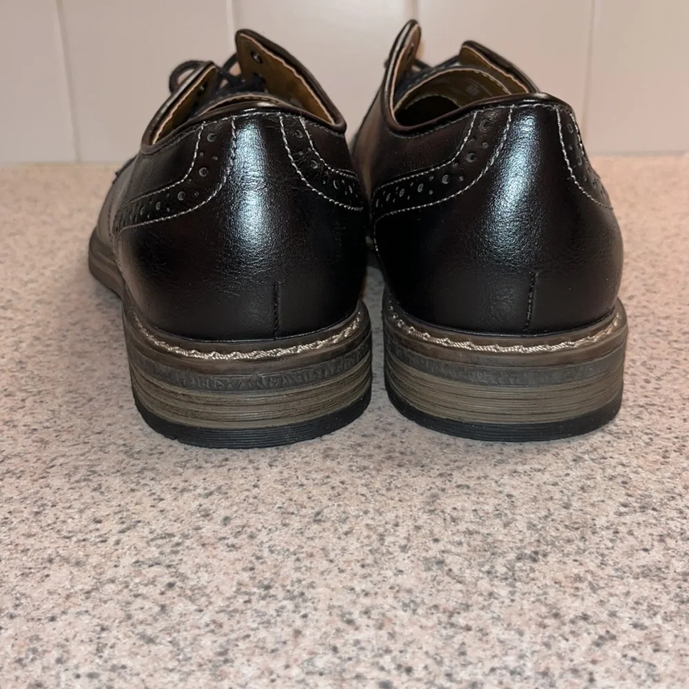 Brand New Never worn Men Dress shoes. Black with black laces.